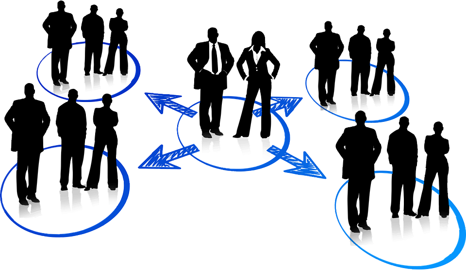 A group of people shaking hands at a networking event